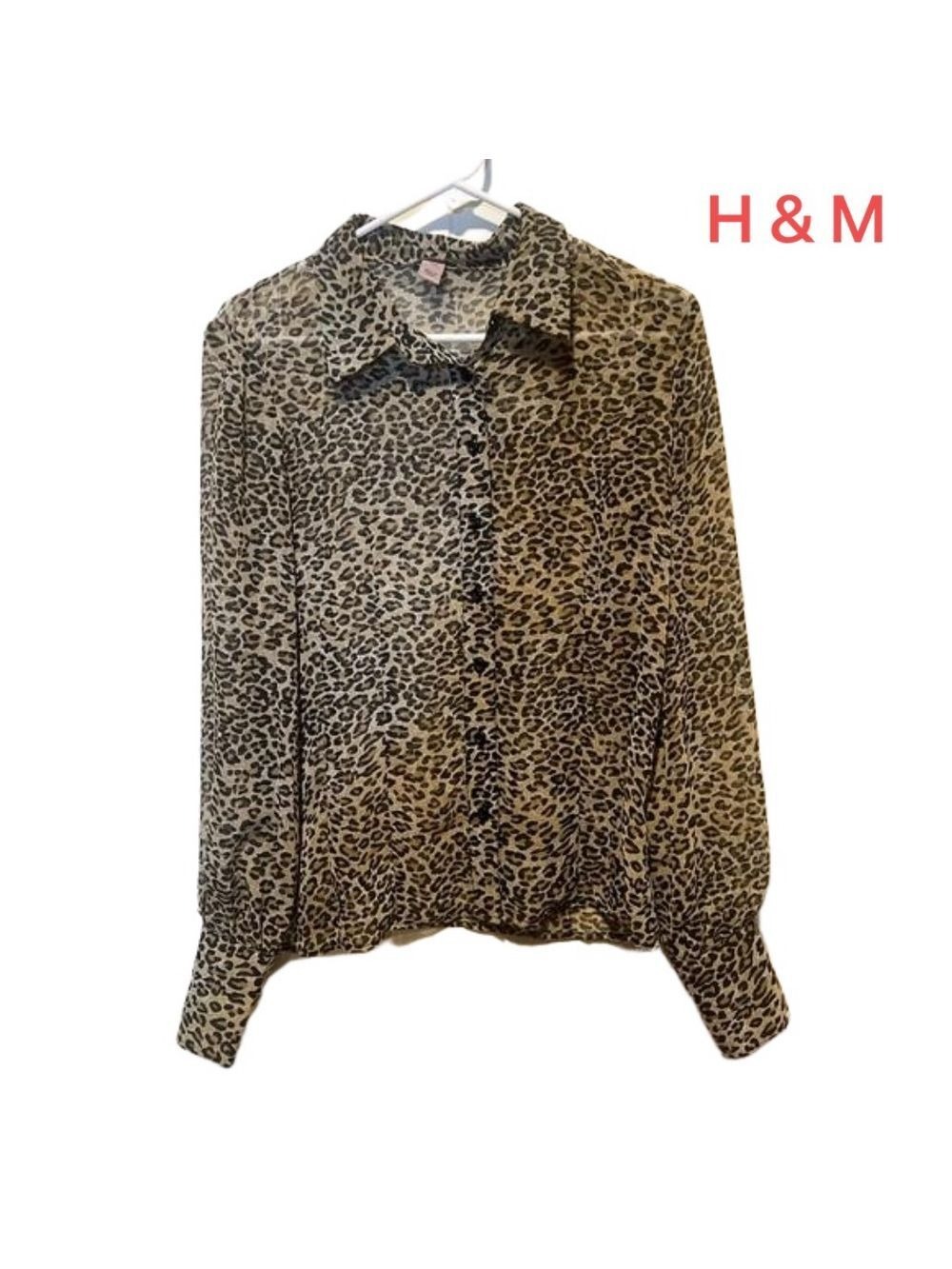 H&M Leopard design blouse size medium but fits more like a small. Long sleeve